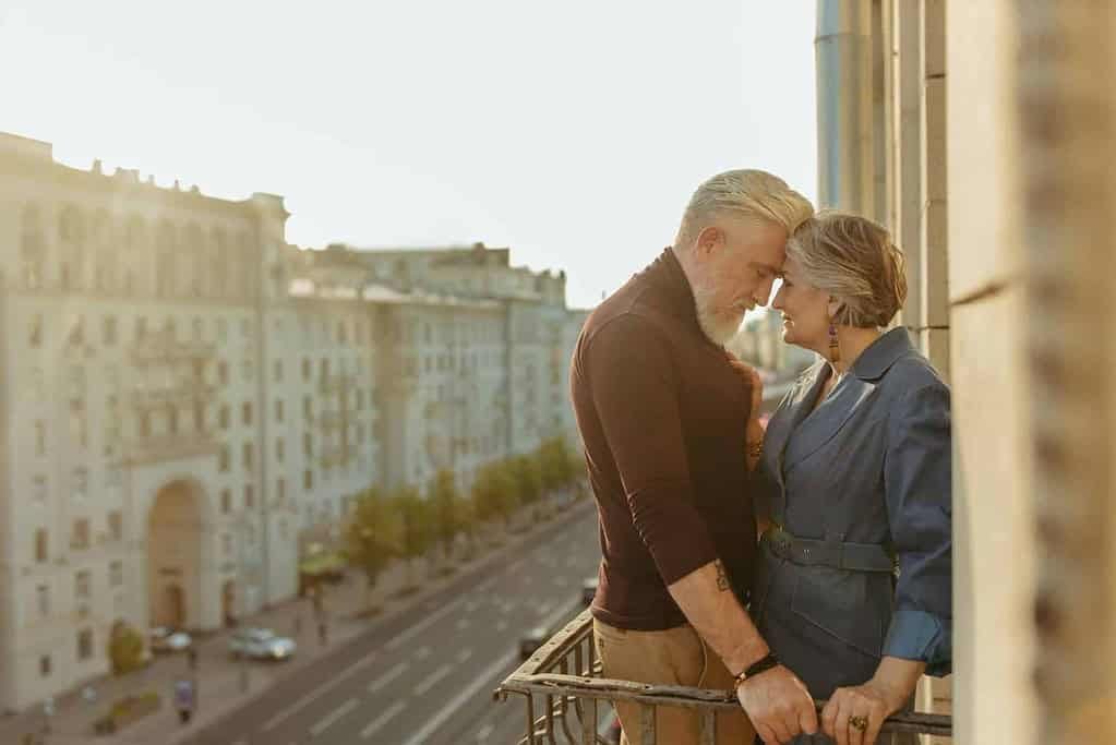 A Couple Standing on the Balcony