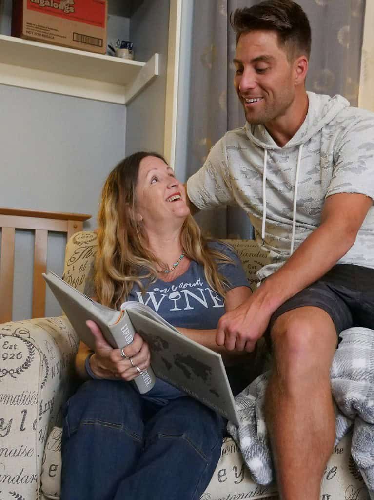 A Mother and a Son Looking at a Photo Album