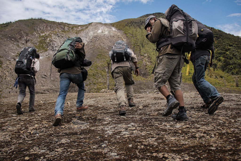 Five Men Running Near Mountain